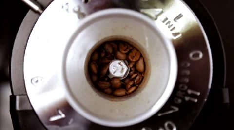 Coffee beans are ground in a coffee grinder Stock Footage 66453906