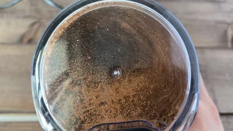 Coffee beans are ground in a coffee grinder Stock Footage 237446982
