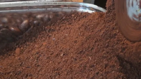 The coffee beans are ground in an old manual coffee grinder. Close-up of Video stock 143691841