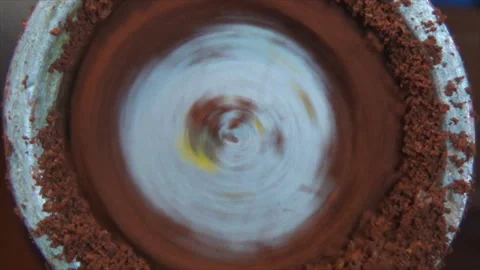 The coffee beans are ground in an old manual coffee grinder. Close-up of Stock-Footage 144684946