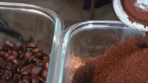 The coffee beans are ground in an old manual coffee grinder. Close-up of Stock Footage 145411239