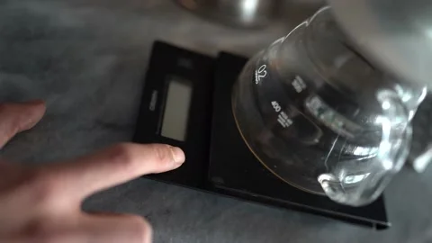Coffee beans are measured with a precision scale Stock Footage 181100297