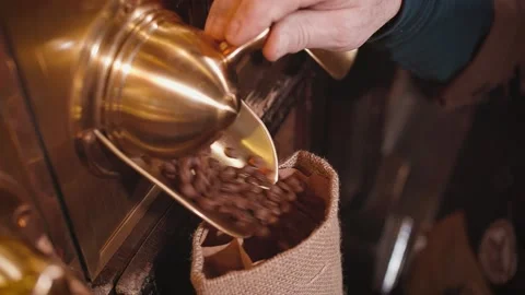 Coffee beans are poured into a bag Stock Footage 150622697