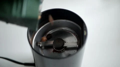 Coffee beans are poured into the coffee grinder Stock Footage 150447451