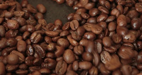 Coffee beans are roasted in a frying pan Stock Footage 105681378
