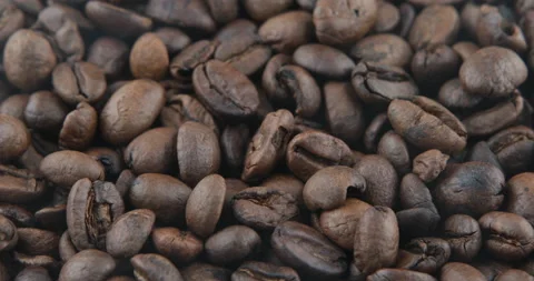 Coffee beans are roasted in a frying pan Stock Footage 107328228