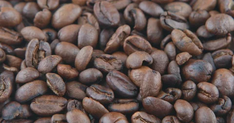 Coffee beans are roasted in a frying pan Stock Footage 107345341