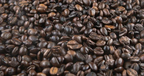 Coffee beans are roasted in a frying pan Stock Footage 107345577