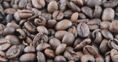 Coffee beans are roasted in a frying pan Stock Footage 107345782
