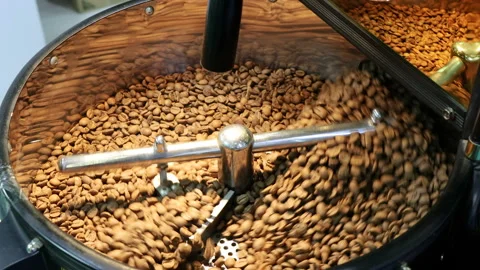 Coffee beans are roasted in the roasting machine. Coffee grinding and roasting Stock-Footage 283757504