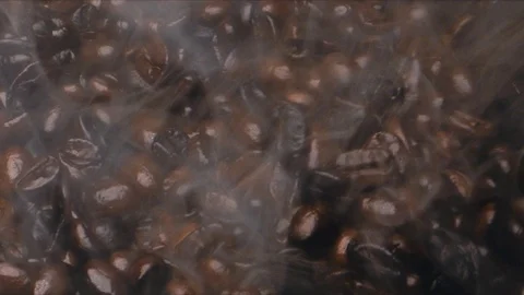Coffee beans are roasted with smoke Stock Footage 117398625