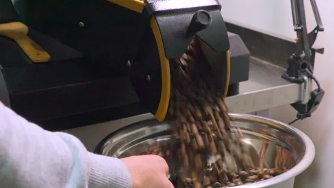 Coffee beans are roasting, view in the round hole. Video Stock Footage 220349077