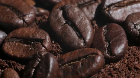 Coffee beans are rotates, slow motion. Coffee beans roasted close-up.Vietnamese  Stock Footage 155117880