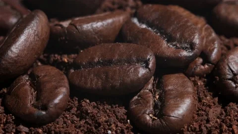 Coffee beans are rotates, slow motion. Coffee beans roasted close-up.Vietnamese  Video stock 155118089