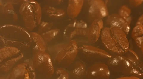 Coffee beans are steaming close up Stock Footage 57681288