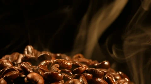 Coffee beans are steaming close up Stock Footage 57685306