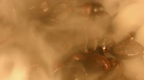 Coffee beans are steaming close up Stock Footage 57687788