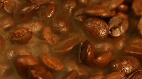 Coffee beans are steaming close up Stock Footage 57723217