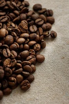 Coffee beans are on table after roasting. Stock Photos