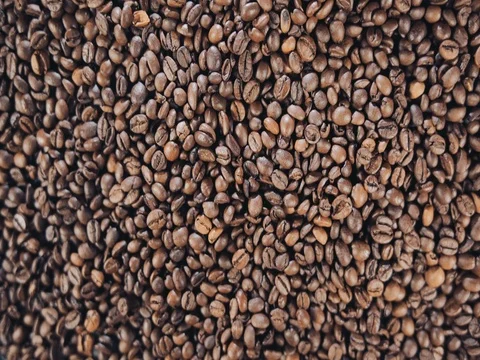 Coffee beans are on the table. Rotate. Slow motion Stock Footage 73670055