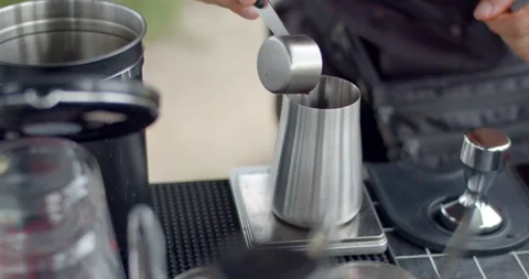 Coffee beans are weighed before grinding to get just the right amount of flavor. Stock Footage 243960650