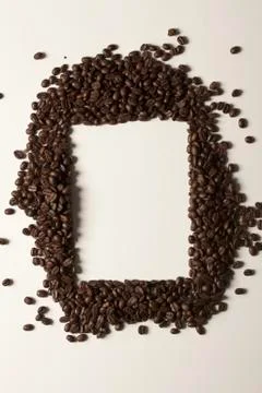 Coffee beans arranged around a rectangle shape Stock Photos