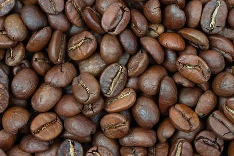 Coffee beans background. Background of roasted coffee beans. Stock Photos