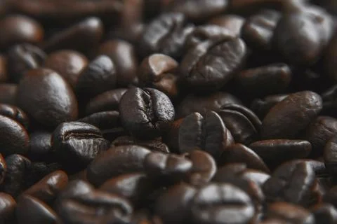 Coffee beans background. Brown roasted coffee beans. Closeup shot of coffee.. Stock Photos