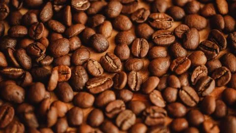 Coffee beans background. Closeup view. Background for website design or brochure Stock Photos