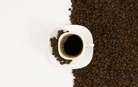 Coffee beans background. Coffee beans on a white background, copy space. Stock Photos