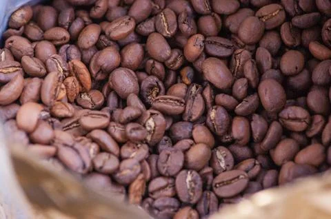 Coffee beans background. Light roasted natural coffee beans. Morning and vigo Stock Photos
