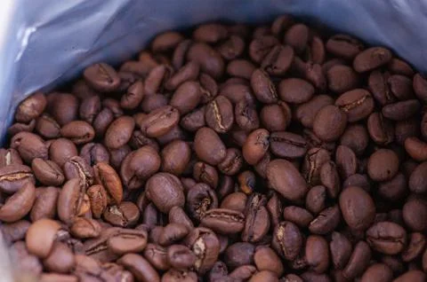 Coffee beans background. Light roasted natural coffee beans. Morning and vigo Stock Photos