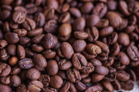 Coffee beans background. Light roasted natural coffee beans. Morning and vigo Stock Photos