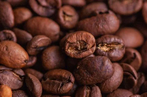 Coffee beans background. Light roasted natural coffee beans. Morning and vigo Stock Photos