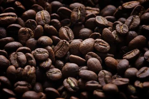 Coffee beans background. Low key. Stock Photos
