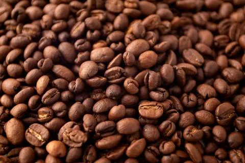 Coffee beans background. Roasted coffee fullframe. Texture of dark coffee bea Stock Photos