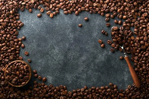 Coffee beans background. Roasted Coffee beans on dark black stone background. 写真素材