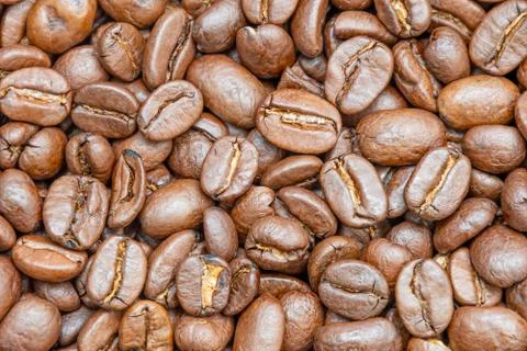 Coffee beans background texture of roasted seeds close up