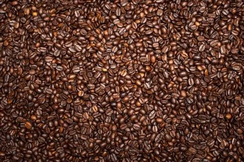 Coffee beans background view from above. Stock Photos