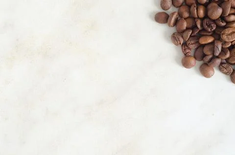 Coffee beans background.Heap of coffee beans in the corner. Stock Photos