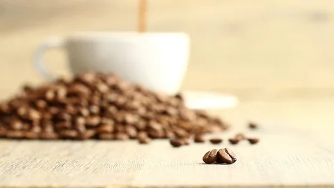 Coffee beans backplane coffee cup full Stock Footage 76536503