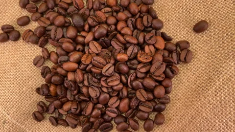 Coffee beans on a bag, rotating Stock Footage 220670449