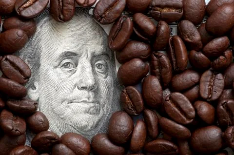 Coffee beans on bank note Stock Photos
