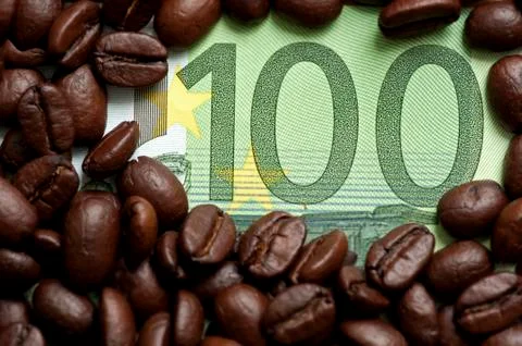 Coffee beans on bank note Stock Photos