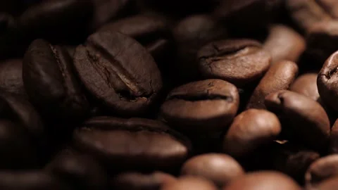 Coffee beans. Beam of light stops and reveals beautiful roasted coffee beans Stock-Footage 168661183