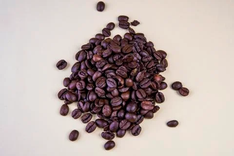 Coffee beans on beige background Foto stock