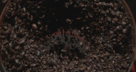 A coffee beans being grinded in slow motion Stock Footage 97808693