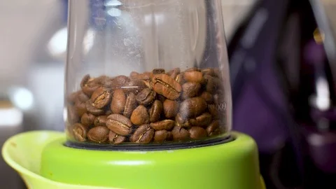 Coffee beans being ground slow motion Stock Footage 94772578