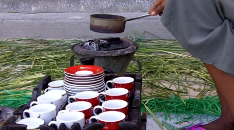 Coffee beans being roasted over charcoal for coffee ceremony Video stock 60967340