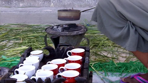 Coffee beans being roasted over charcoal for coffee ceremony Video stock 60969427